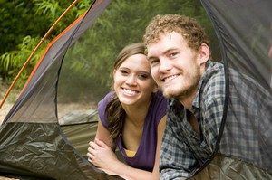 Couple camping in a tent